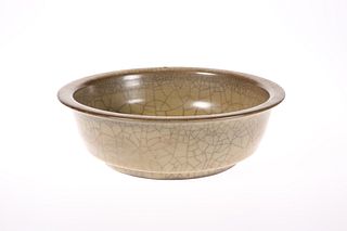 A CHINESE CELADON GLAZED BOWL, circular with ever