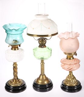 THREE VICTORIAN BRASS OIL LAMPS, the first with m