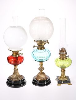 THREE VICTORIAN BRASS OIL LAMPS, the first with b