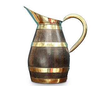 A BRASS AND COOPERED OAK PITCHER, of ovoid form. 