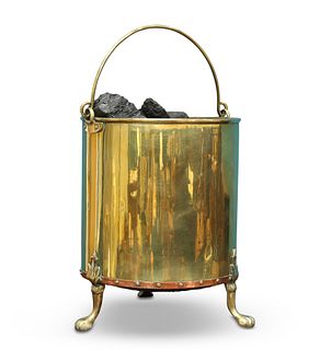 A POLISHED BRASS COAL BUCKET, cylindrical with sw