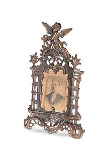 A VICTORIAN PATINATED METAL PHOTOGRAPH FRAME, in 