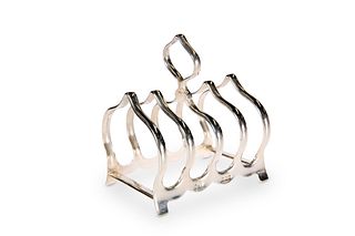 A GEORGE V SILVER TOAST RACK, by William Suckling