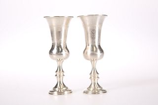 A NEAR PAIR OF GEORGE V SILVER KIDDUSH CUPS, by J