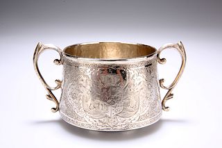 A FINE PERSIAN SILVER TWO-HANDLED BOWL, chased wi