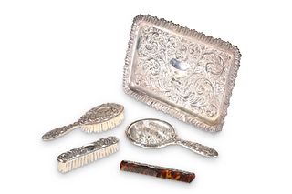 A DRESSING TABLE SET, comprising a silver-backed 