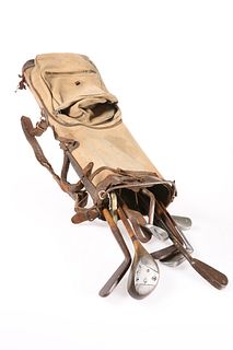 A GOLF BAG CONTAINING OLD WOODS, CLUBS, BALLS, in