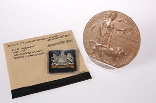 A WW1 DEATH PLAQUE AND CAP BADGE, 203409 Pte. Wil