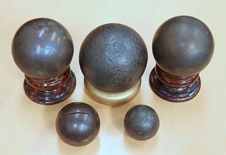 FIVE CANNON BALLS, various sizes, two on Victoria