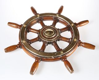 A BRASS-MOUNTED TEAK SHIP'S WHEEL, of eight-spoke