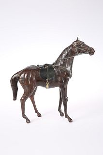 A LEATHER COVERED MODEL OF A HORSE
 probably earl