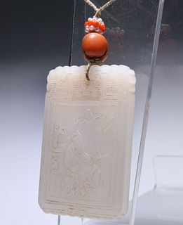 A CHINESE JADE PENDANT, decorated to the front in