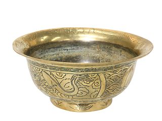 A LARGE CHINESE BRASS BOWL
 Chased with ferocious