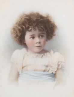 AN EDWARDIAN COLOURED PHOTOGRAPHIC PORTRAIT OF A 