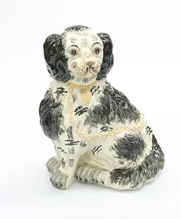 A POTTERY MODEL OF A SEATED SPANIEL. 32cm high