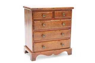 A 19TH CENTURY MAHOGANY MINIATURE CHEST OF DRAWER