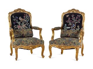 A Pair of Louis XV Style Carved Giltwood Fauteuils