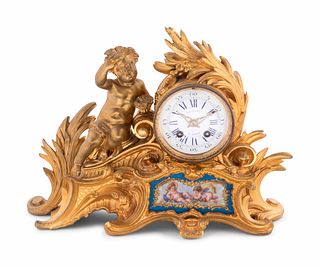 A Louis XV Style Porcelain Mounted Gilt Bronze Figural Mantel Clock