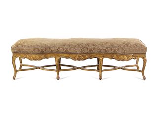 A Louis XV Style Carved Giltwood Serpentine Window Bench