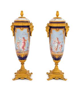 A Pair of Sevres Style Gilt Bronze Mounted Painted, Parcel Gilt and "Jeweled" Porcelain Urns