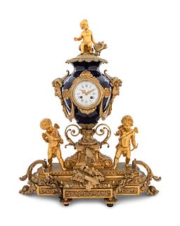 A Sevres Style Gilt Bronze and Porcelain Mantel Clock