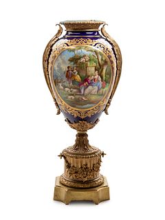 A Sevres Style Gilt Bronze Mounted Painted and Parcel Gilt Porcelain Urn