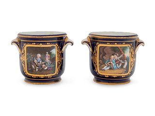 A Pair of Sevres Style Painted and Parcel Gilt Porcelain Cache Pots