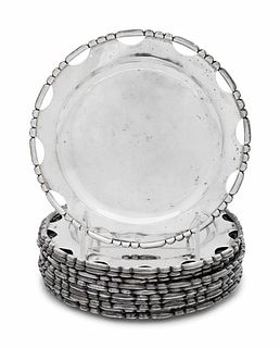 A Set of Twelve Mexican Silver Bread Plates