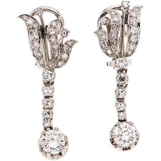 Pair of 14k white gold earrings with 2 brilliant cut diamonds ~1.20 ct. Clarity: VS2. Color: I. Weight: 8.5 g