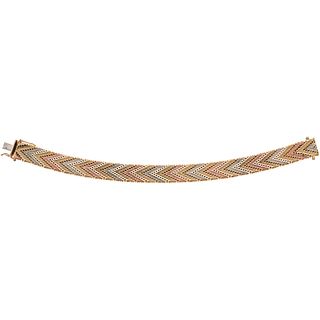 Bracelet in 14k yellow, white, and pink gold. Weight: 37.4 g. Length: 7"