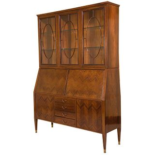 Bookcase-secretaire. Italy. 1990s. Based on design by Paolo Buffa. In rosewood veneered wood. With 7 doors and 4 drawers.