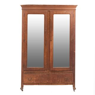 Wardrobe. 20th century. Carved in wood. 2 hinged doors with rectangular, beveled mirrors, drawer with handles. 79.5 x 53.5 x 22" (202x136x56cm)