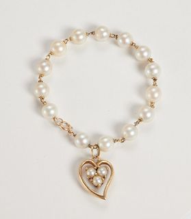 Pearl bracelet with 14k and dangling heart charm