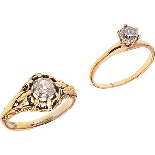 TWO SOLITAIRE RINGS. 14K YELLOW GOLD