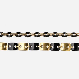 Pair of black onyx and gold bracelets
