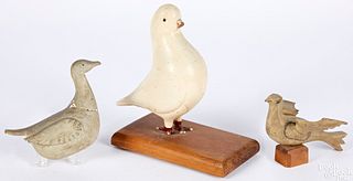 Three carved and painted birds