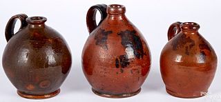 Three redware ovoid jugs