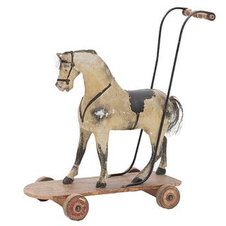 Toy Horse. 19th century. Carved in polychrome wood and natural horsehair. Decorated with applications of organic fibers.