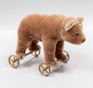 Teddy Bear. Germany. 20th century. Steiff. Plush toy. Metal wheels support. With button.