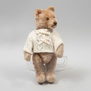 Teddy Bear. Germany. 20th century. Steiff. Plush toy. Dressed in cream-colored sweater. 8.6" (22 cm)