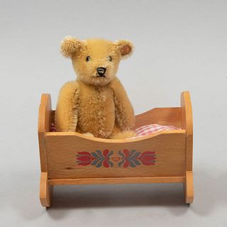 Teddy Bear. Germany. 20th century. Steiff. Plush toy. With brand button and crib.