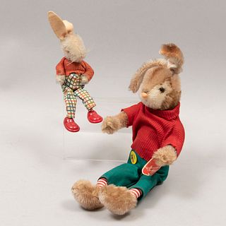 Lot of 2 Bunnies. Germany. 20th century. Plush toy. Schuco. Dressed in sweaters, pants and one with shoes.