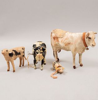 Lot of 4 toy animals, 2 automatons. 20th century. Made in sheet with leather coating. Consists of: pig, calf, and two cows.
