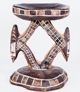 A Carved and Painted Wooden African Stool, 20th Century.