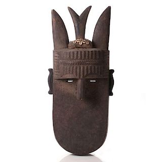 A Tomo Landa Carved Wood Mask, Republic of Guinea, 20th Century.