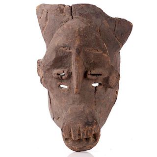 A Igbo Tribe Carved Wood Mask, 20th Century.