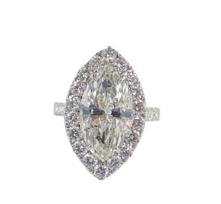 GIA Certified. 5.34ct Marquise SI2/J Set In 18 Karat White Gold Setting Containing 2.20ct of diamonds