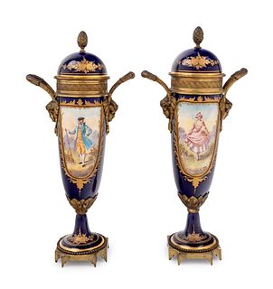 A Pair of Sevres Style Gilt Metal Mounted Painted and Parcel Gilt Porcelain Urns