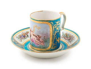 A Sevres Painted, Parcel Gilt and Celeste Blue-Ground Porcelain Cup and Saucer
