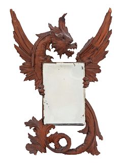 A Renaissance Revival Carved Walnut Mirror